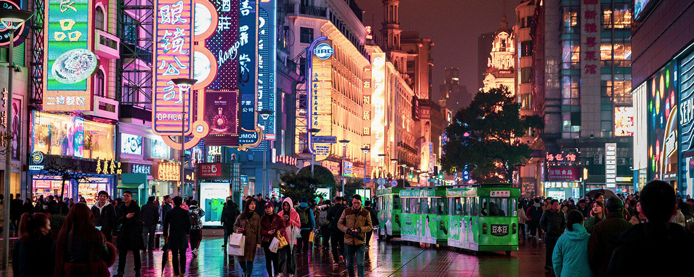 IBT Blog Main Image - Busy street in China with many neon signs