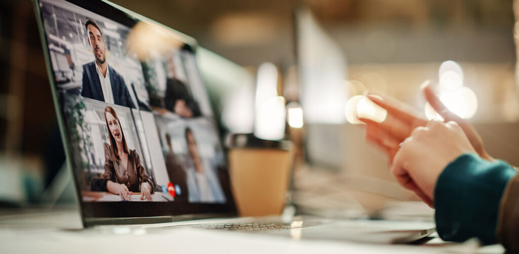 Laptop Screen Containing a Group Video Call of Multiethnic People Discussing Business Project.